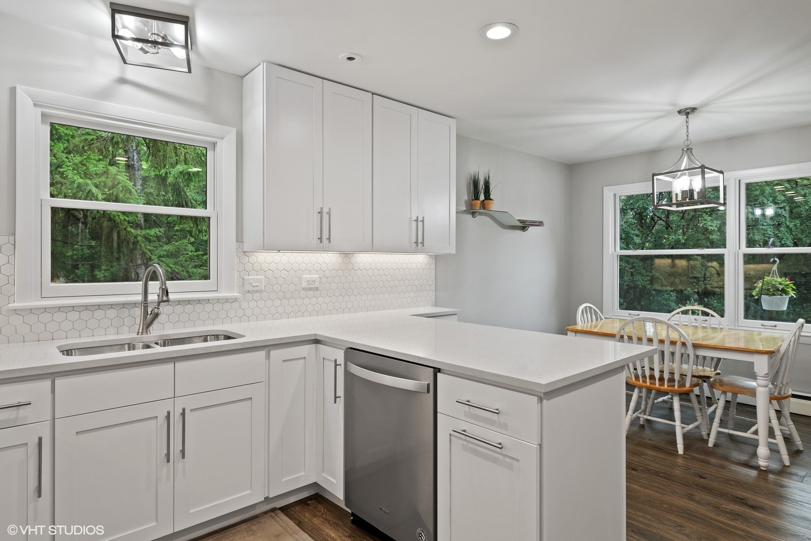 1715 Sequoia Trail Glenview, IL 60025 - Photo 5 of 29 a kitchen with a sink a window and dining table