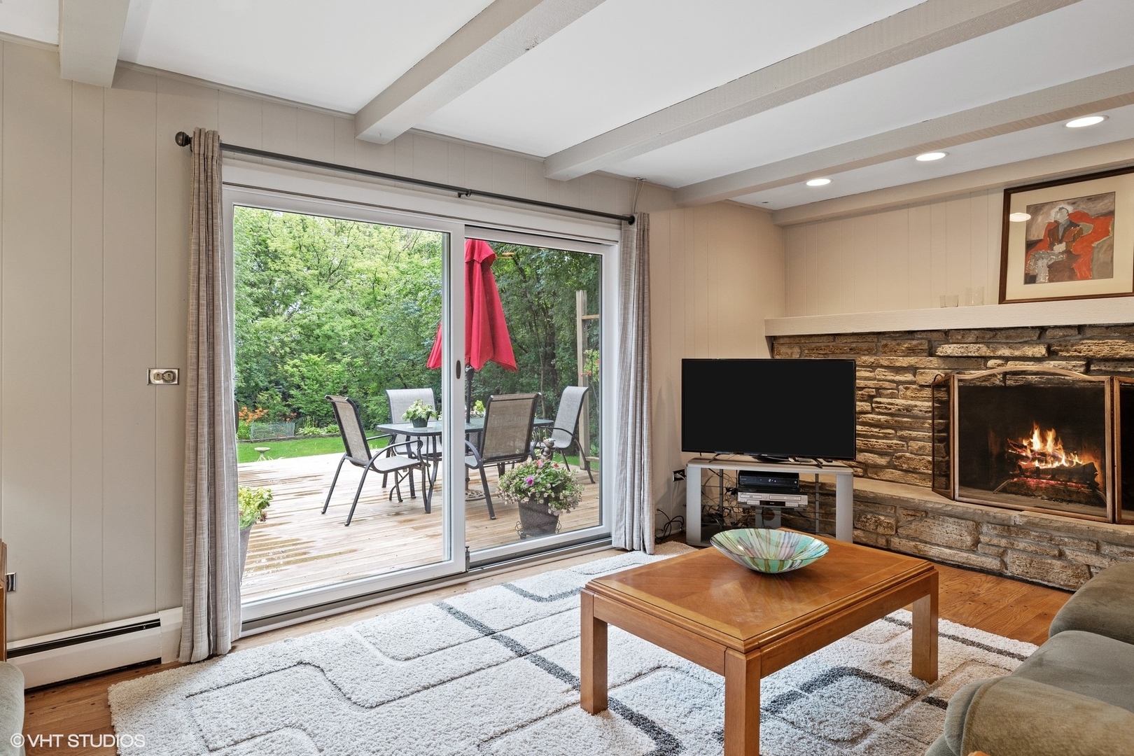 1715 Sequoia Trail Glenview, IL 60025 - Photo 10 of 29 a living room with furniture a flat screen tv and a floor to ceiling window