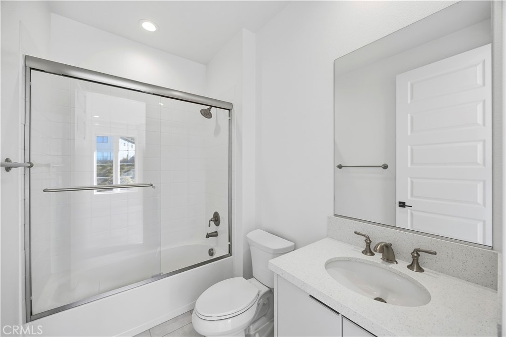 20138 Marlow Lane Porter Ranch, CA 91326 - Photo 27 of 39 a bathroom with a sink toilet and shower