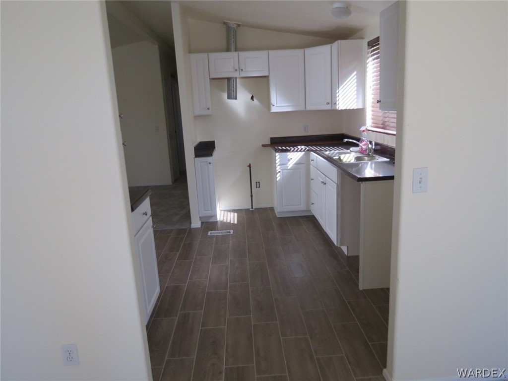 1300 Dike Road Mohave Valley, AZ 86440 - Photo 32 of 49 Mobile Home (2) - Kitchen with tile floor with laminated counter tops