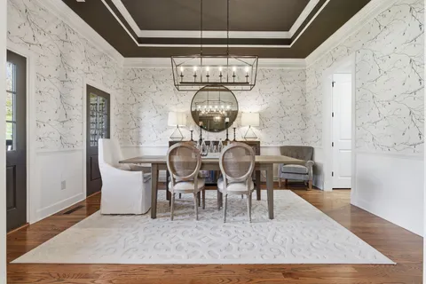 a view of a dining room with furniture and window