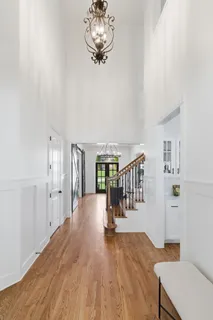 a living room with furniture and a dining table