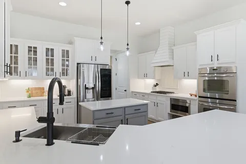 a kitchen with lots of counter space and appliances