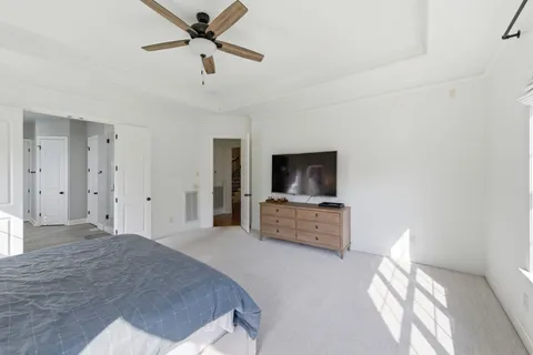 a very nice looking room with a large window and chandelier