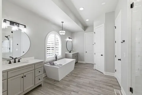 a view of bedroom with a bed and cabinets