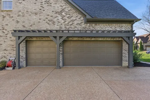 a front view of house with garage