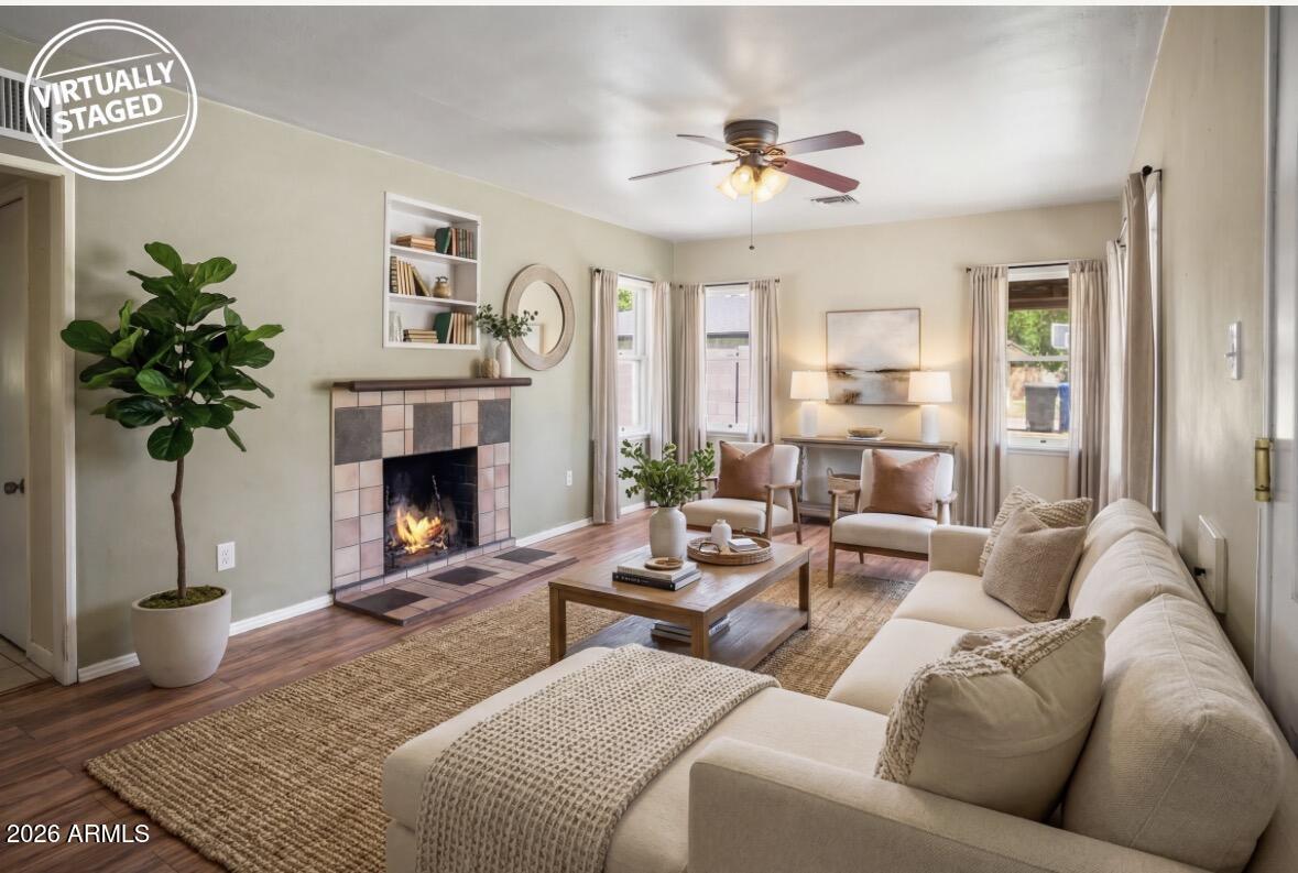 508 North Robson Mesa, AZ 85201 - Photo 6 of 19 a living room with furniture a chandelier and a fireplace