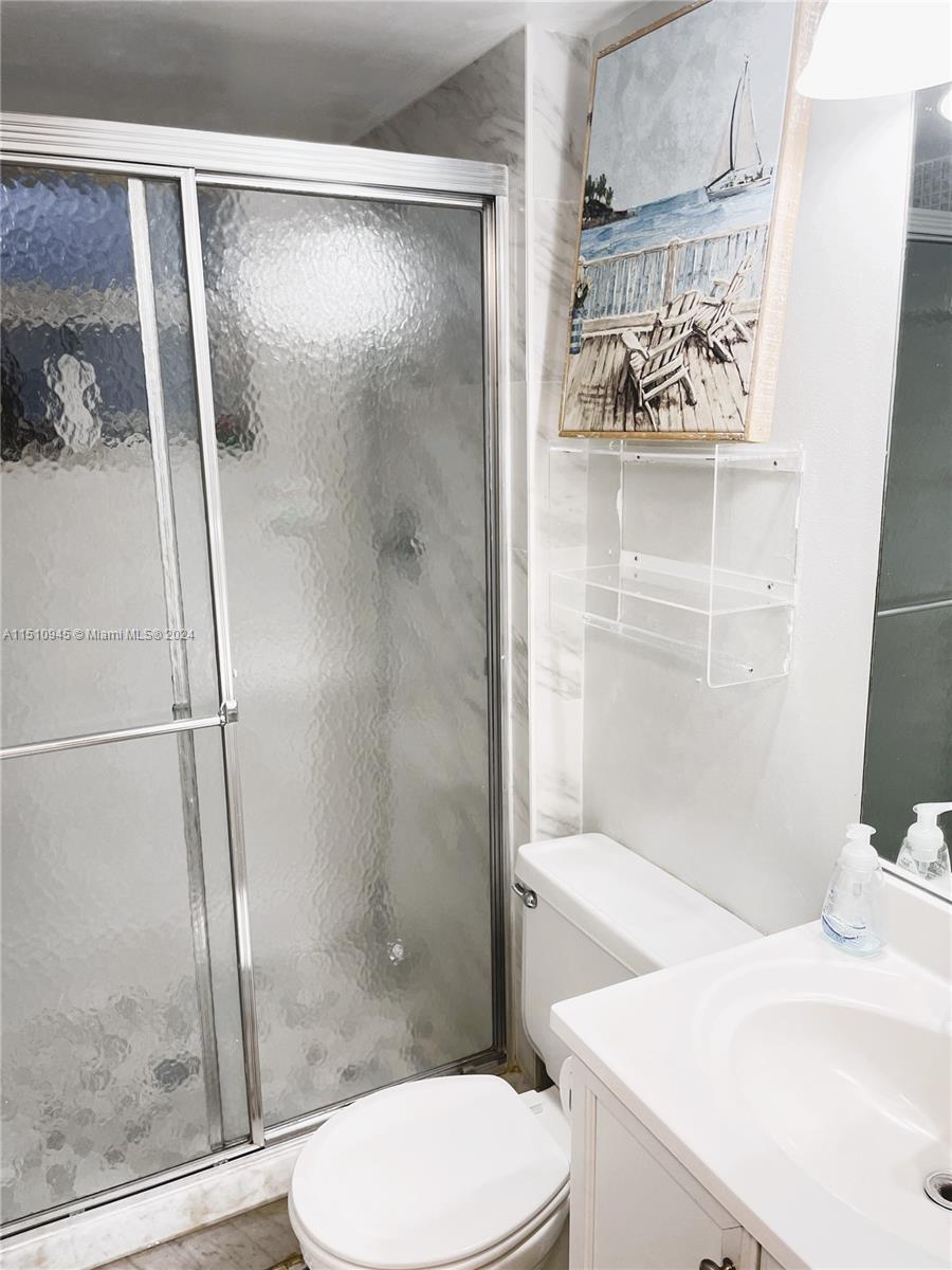 Arrowhead Davie, FL 33324 - Photo 15 of 40 a bathroom with a shower and a toilet