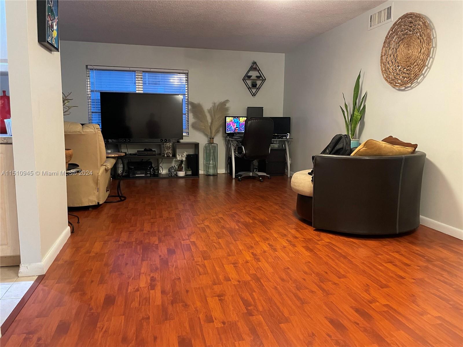 Arrowhead Davie, FL 33324 - Photo 18 of 40 a living room with furniture and a flat screen tv