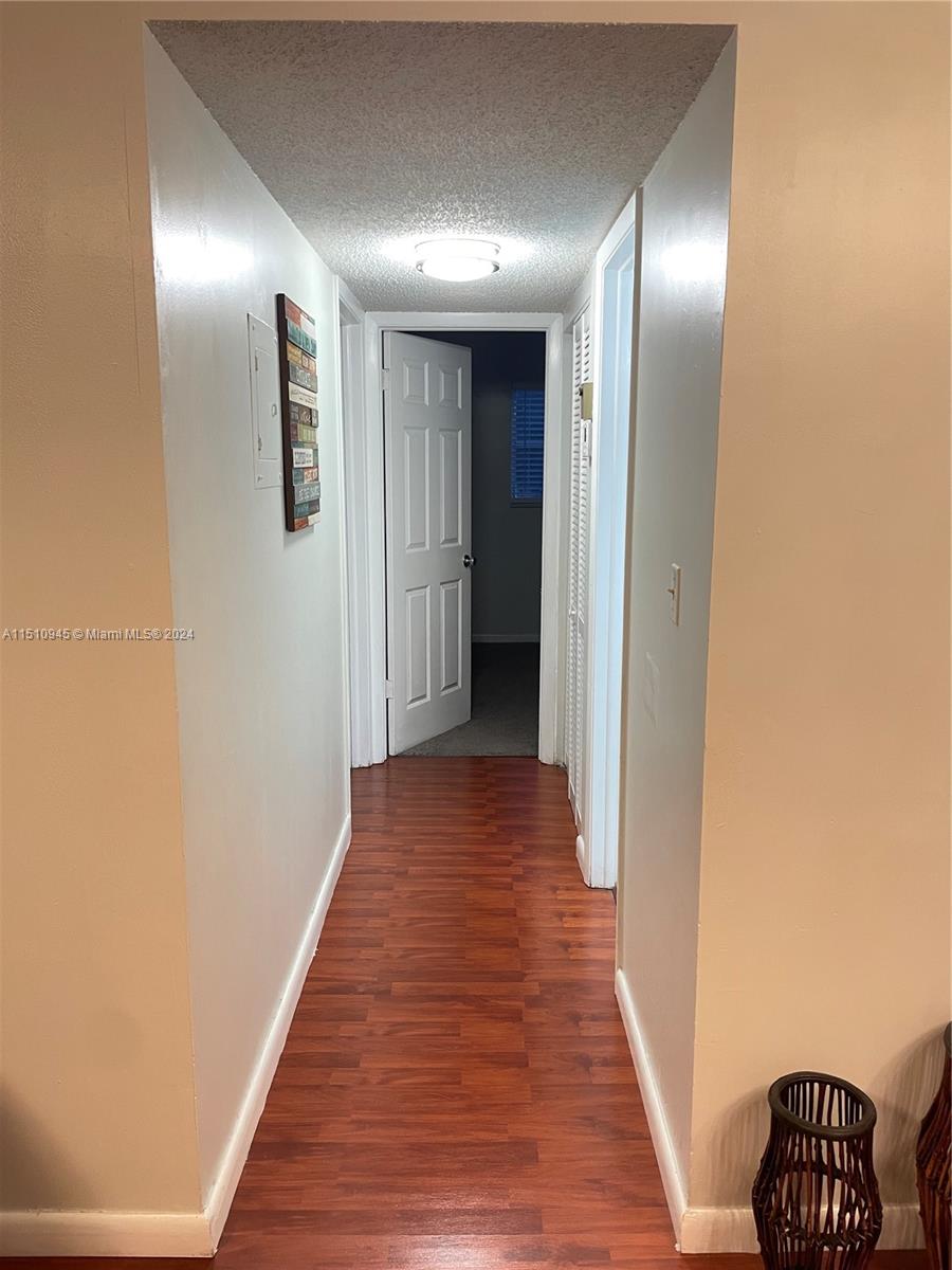 Arrowhead Davie, FL 33324 - Photo 22 of 40 a view of a hallway with wooden floor