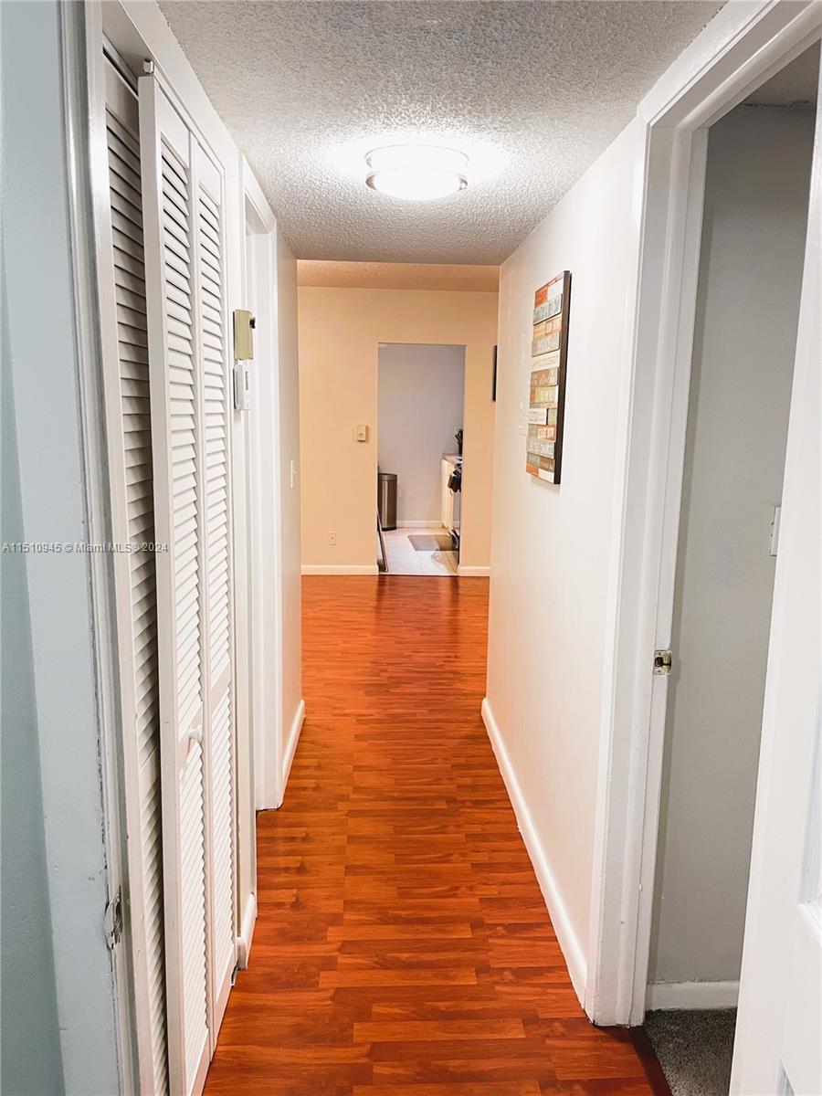 Arrowhead Davie, FL 33324 - Photo 23 of 40 a view of a hallway with wooden floor