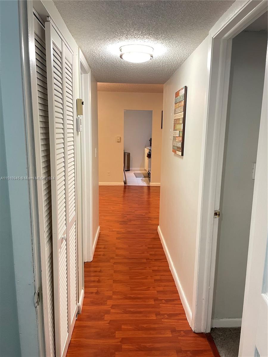 Arrowhead Davie, FL 33324 - Photo 24 of 40 a view of a hallway with wooden floor