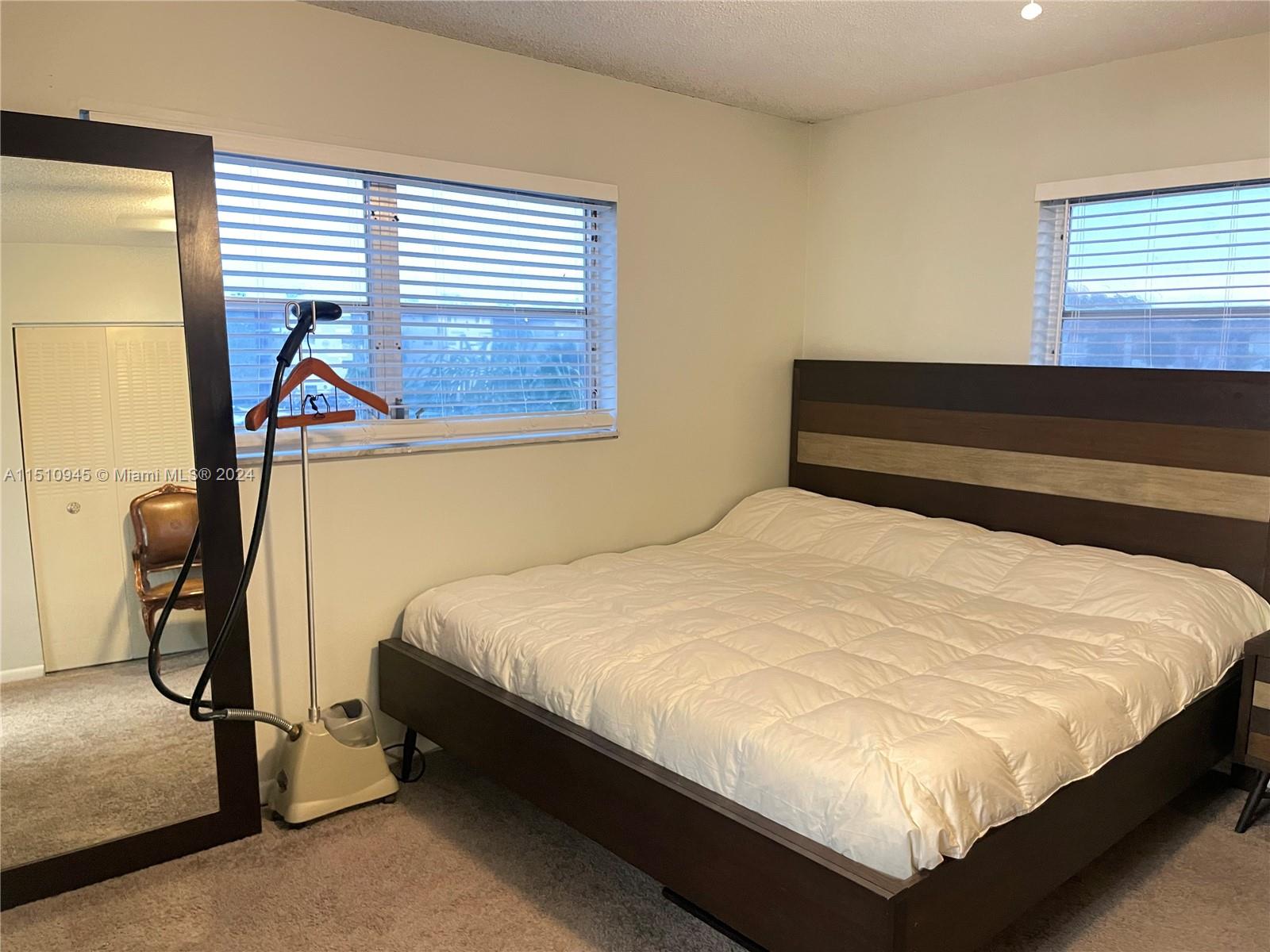 Arrowhead Davie, FL 33324 - Photo 6 of 40 a bedroom with a bed and a window