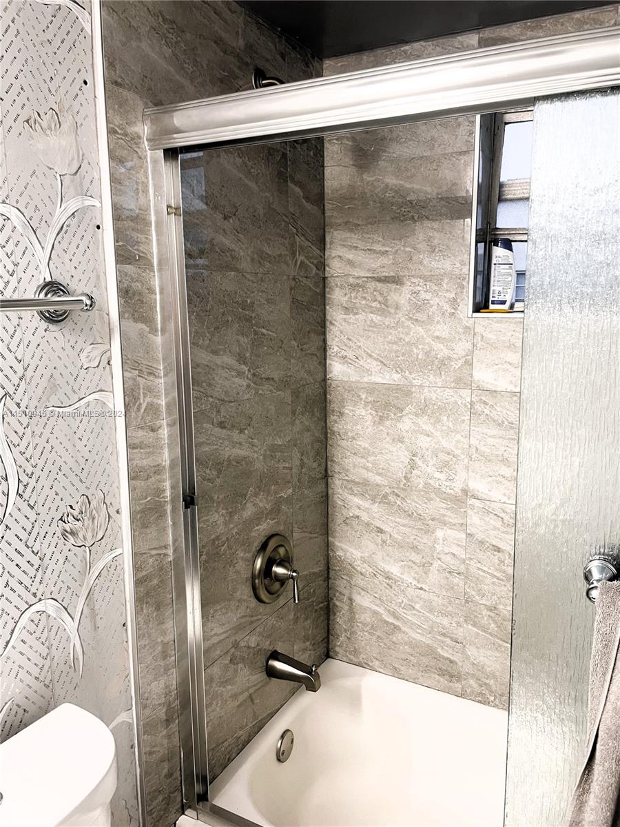 Arrowhead Davie, FL 33324 - Photo 10 of 40 a bathroom with a shower and toilet