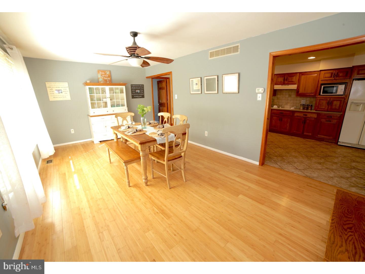 168 Stewart Road Pilesgrove, NJ 08098 - Photo 3 of 17 a view of a dining room with furniture and wooden floor