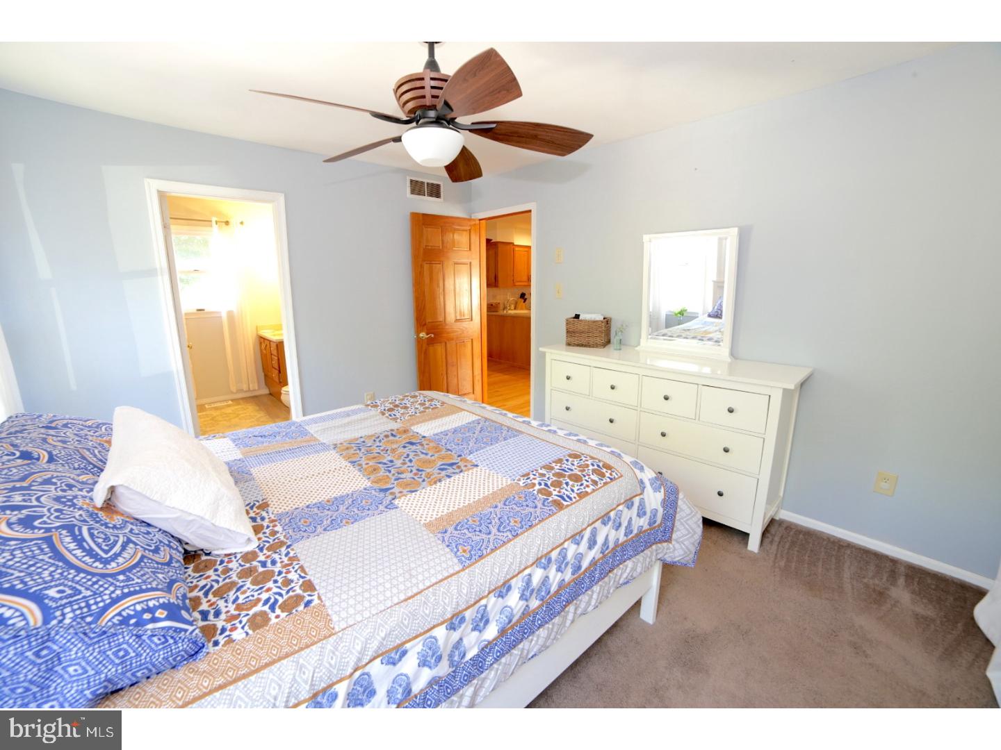 168 Stewart Road Pilesgrove, NJ 08098 - Photo 8 of 17 a bedroom with a bed and a chandelier