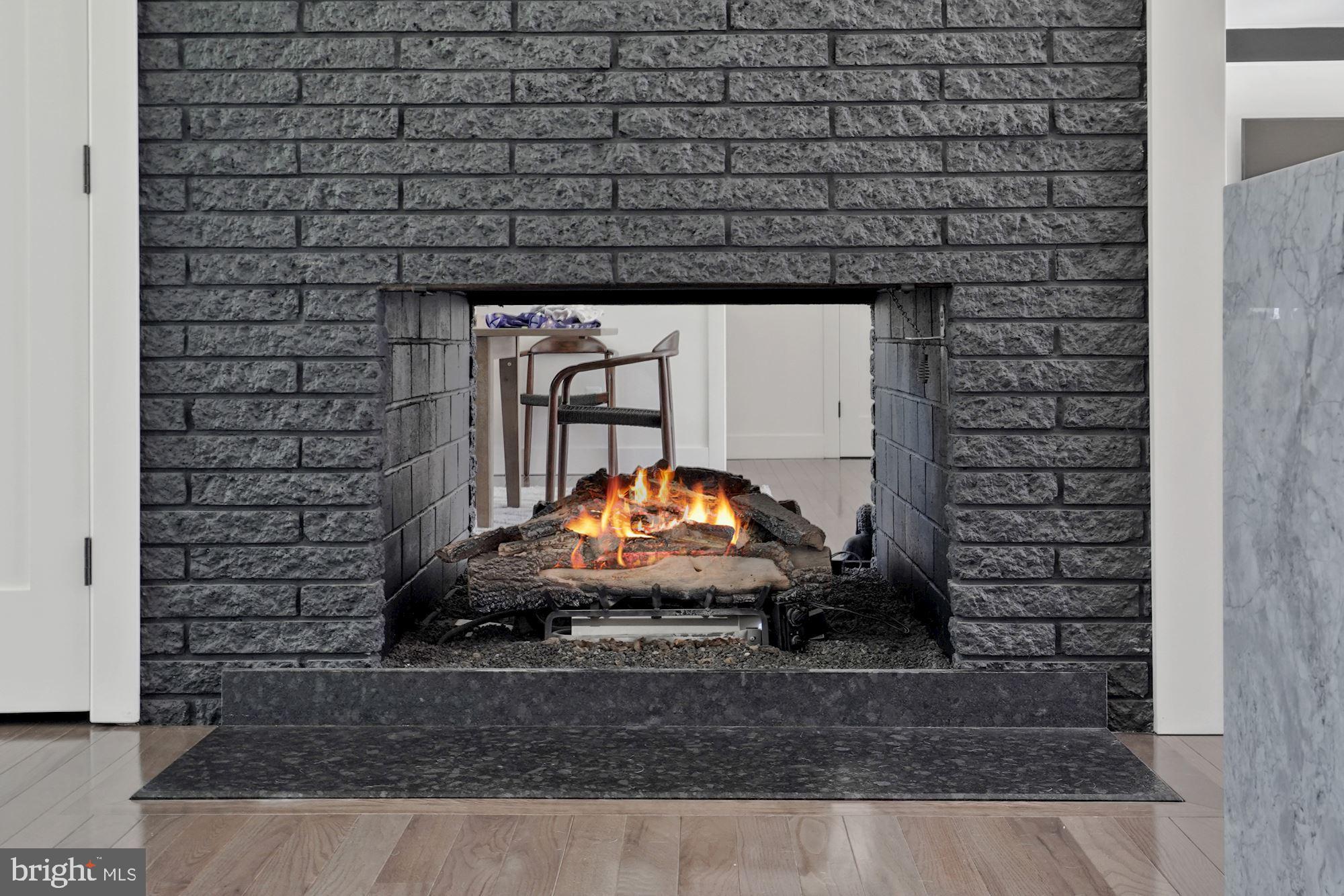 12023 Rusty Road Fairfax Station, VA 22039 - Photo 14 of 60 Dual sided gas fireplace.