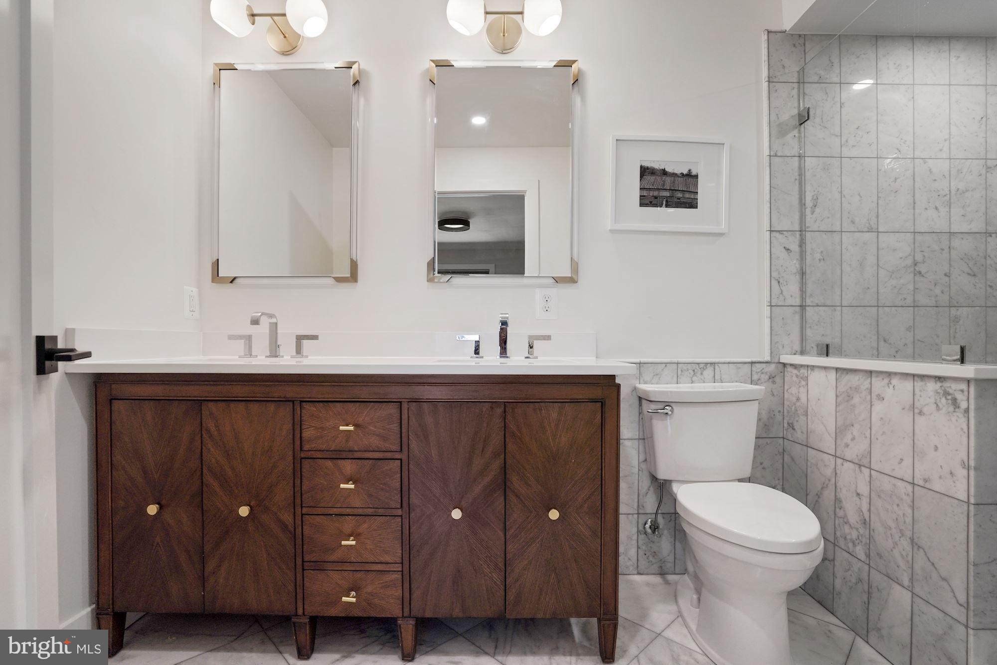 12023 Rusty Road Fairfax Station, VA 22039 - Photo 21 of 60 Dual marble sinks with a custom cabinet.
