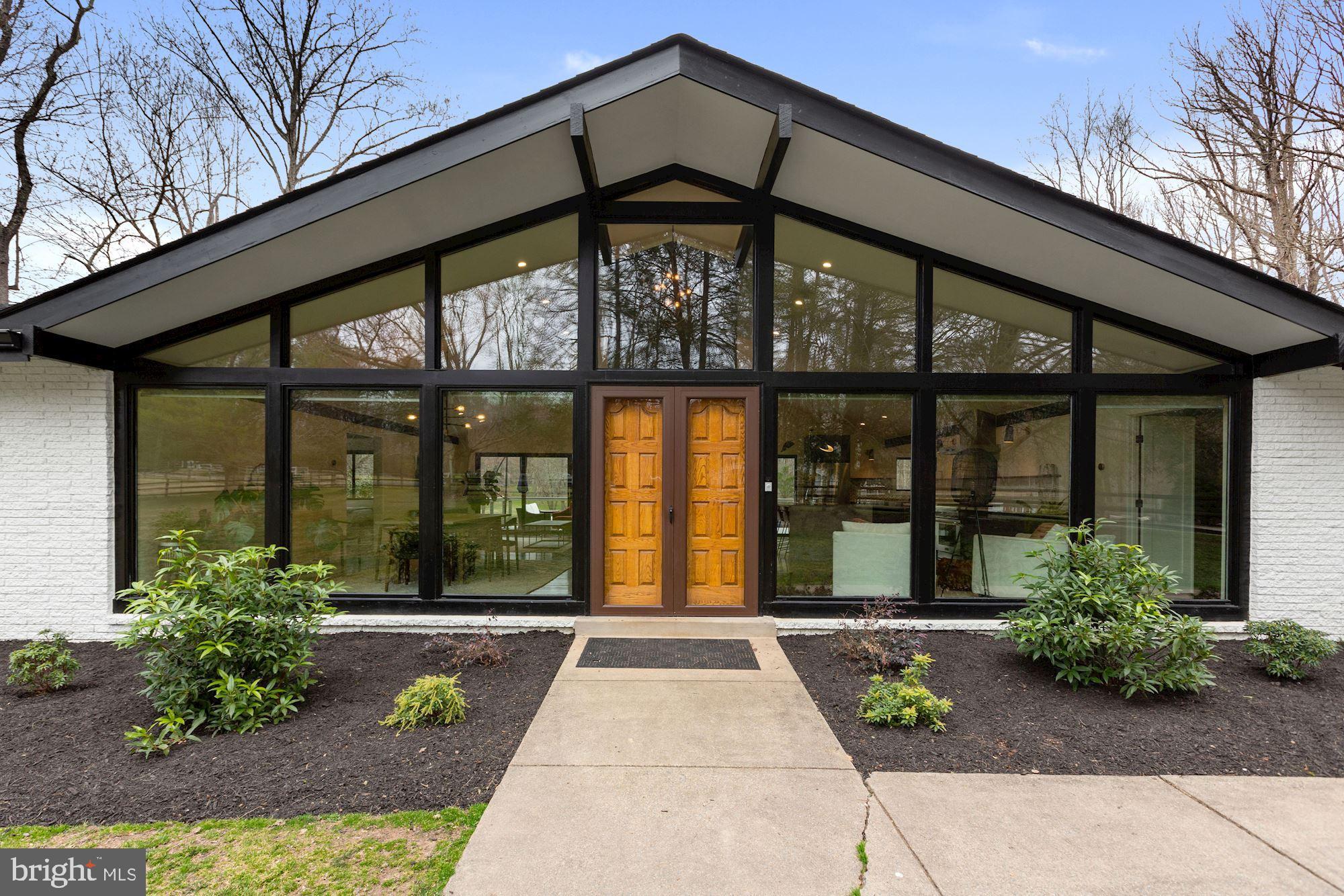 12023 Rusty Road Fairfax Station, VA 22039 - Photo 37 of 60 This sleek home is filled with walls of glass.