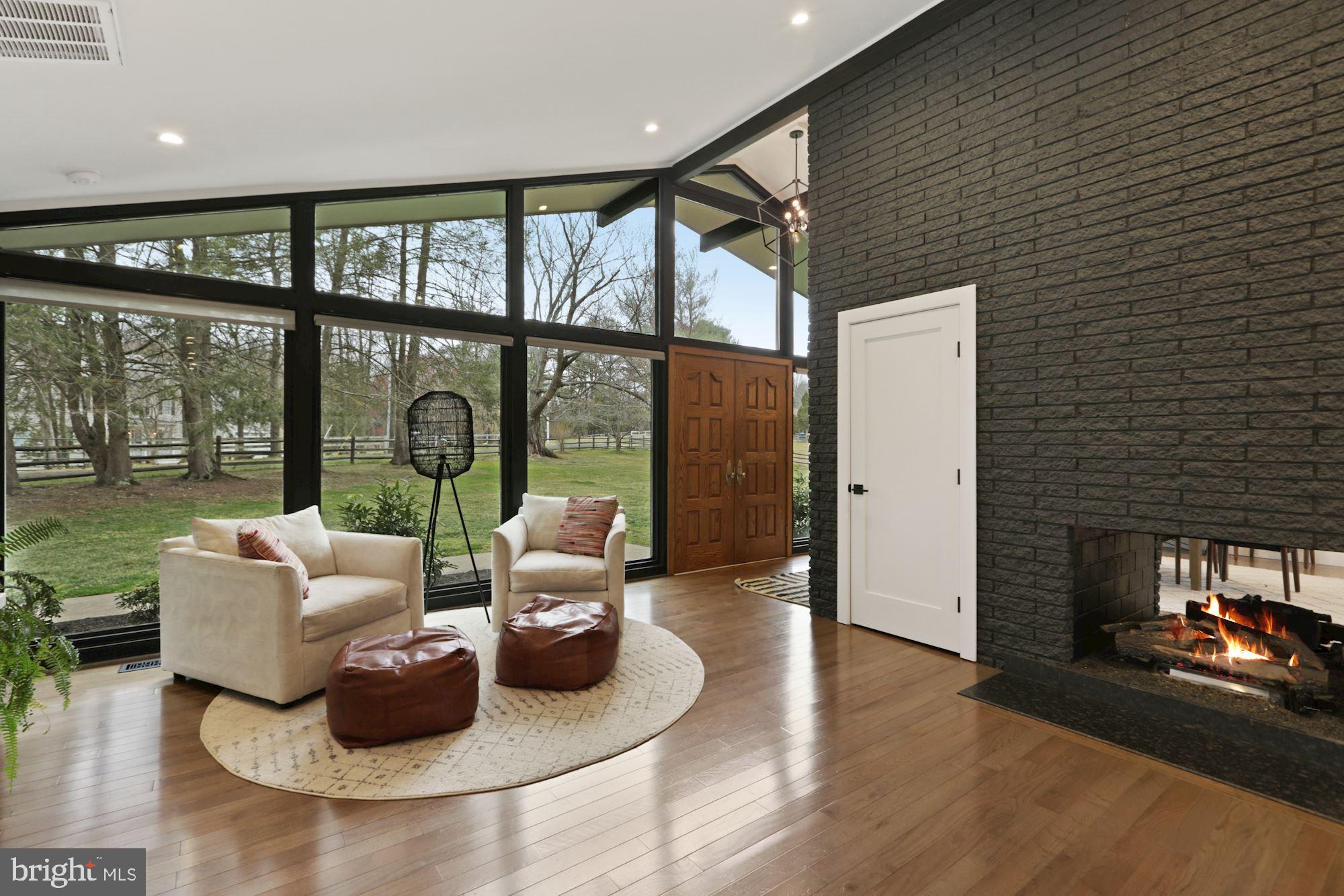 12023 Rusty Road Fairfax Station, VA 22039 - Photo 6 of 60 New hardwood flooring and a dual sided fireplace.