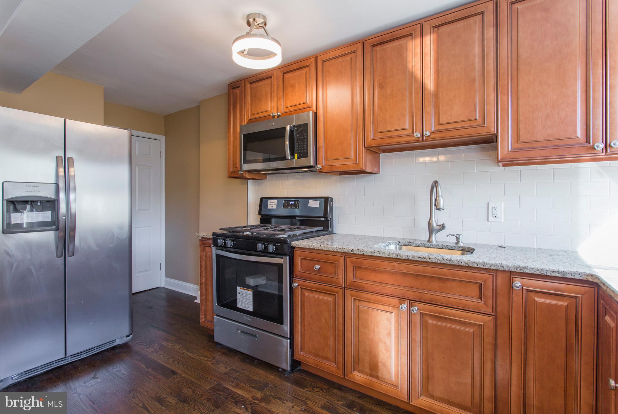 1975 Carter Road Folcroft, PA 19032 - Photo 7 of 25 Kitchen with Stainless Appliances
