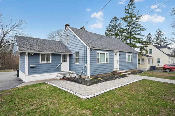 a front view of a house with a yard