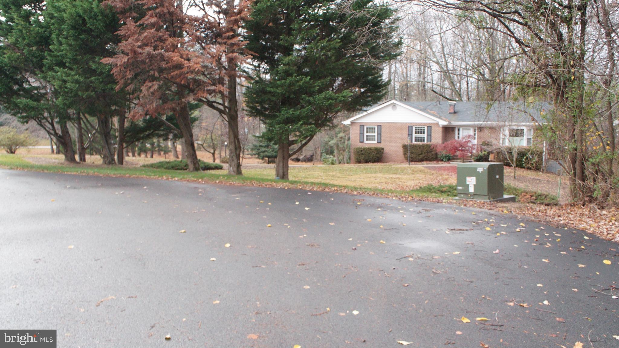 3140 Searsmont Place Herndon, VA 20171 - Photo 8 of 8 a view of a house with a yard and large tree