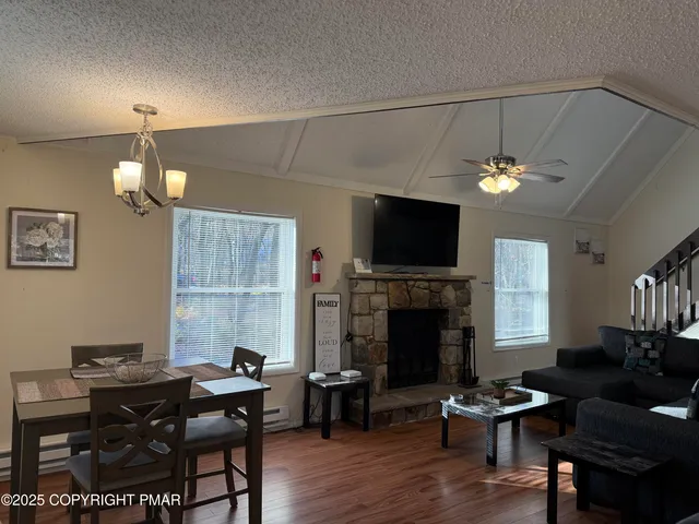 a view of a livingroom with furniture and a fireplace