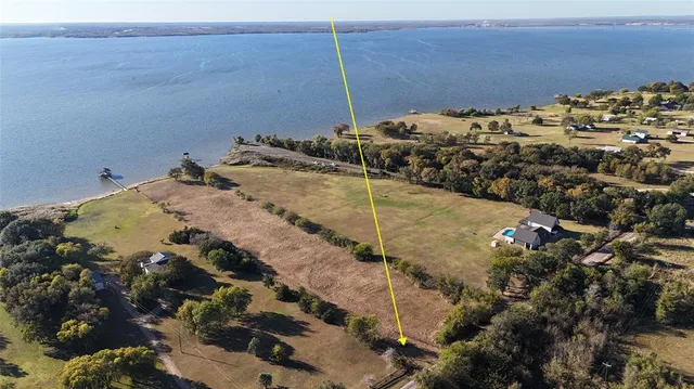 a view of a road with an ocean beach