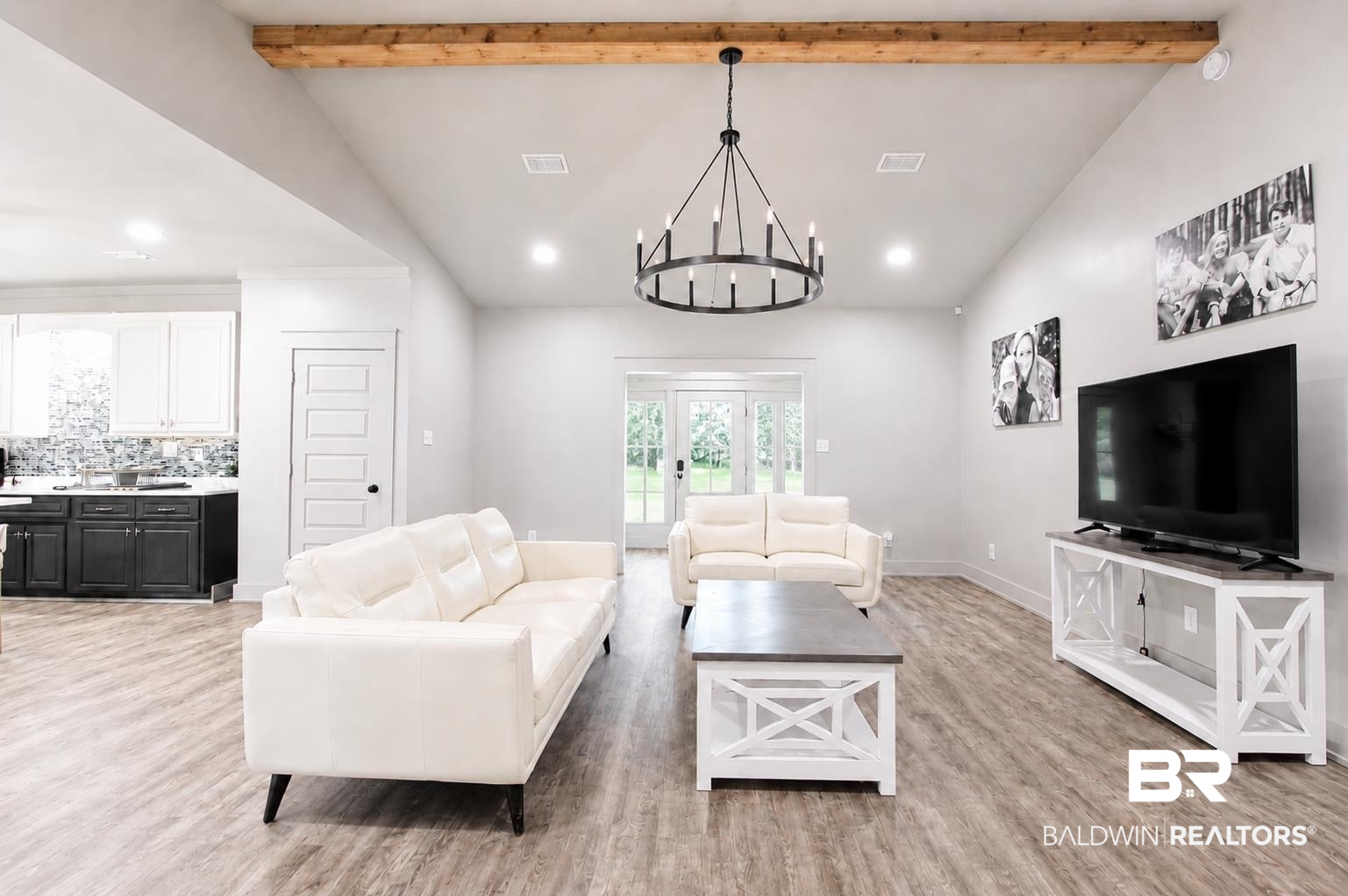 9825 Wolf Creek Ridge Elberta, AL 36530 - Photo 42 of 76 Spacious living area featuring a vaulted ceiling with an exposed wood beam, wood-finish flooring, and recessed lighting