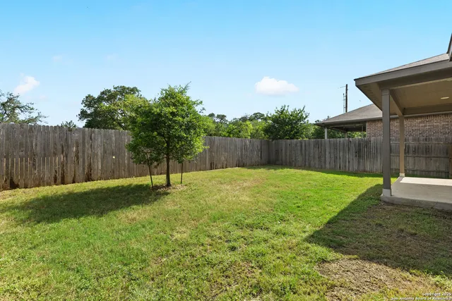 a swimming pool with wooden fence
