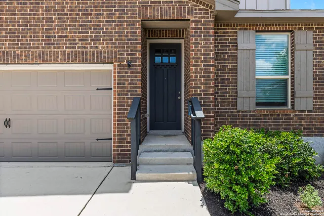 a front view of a house with a gate