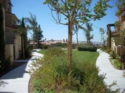 2293 Huntington Point Road, Unit 159 Chula Vista, CA 91914 - Photo 7 of 8 Green space in front of townhome with park benches