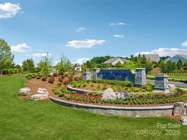 a roof deck with table and chairs
