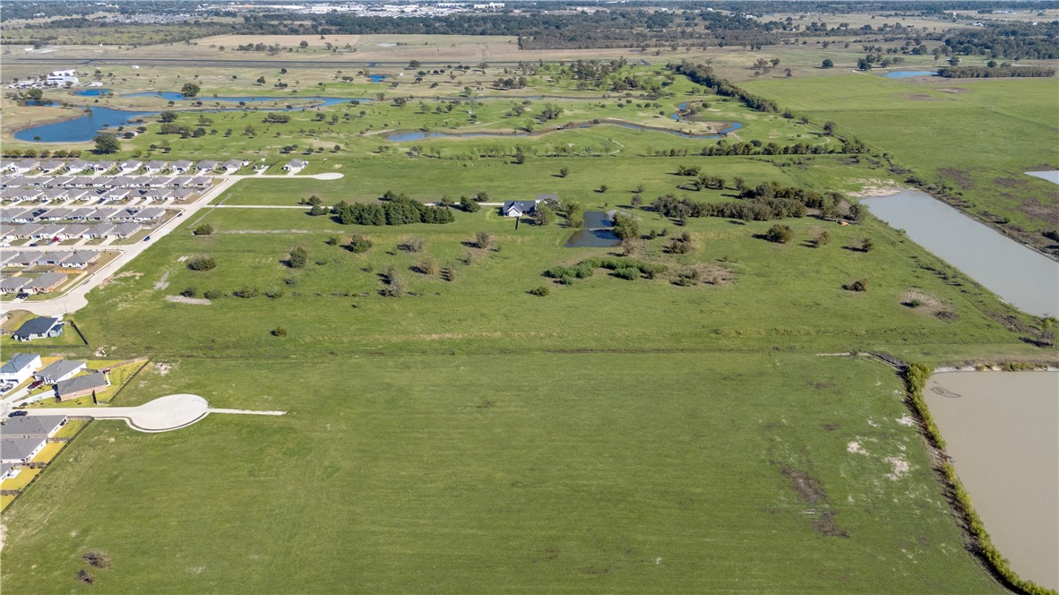 Lot 45 Back Nine Lane Navasota, TX 77868 - Photo 9 of 18 a view of a swimming pool with a yard