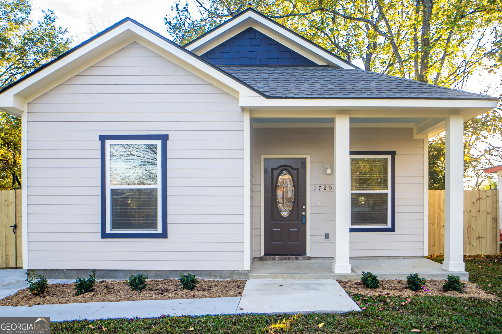 a front view of a house with garage