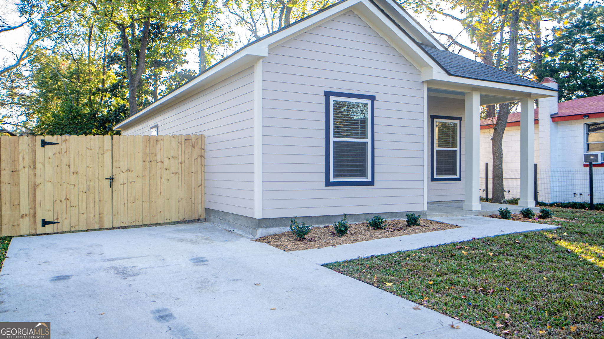 1725 Dunn Street Savannah, GA 31415 - Photo 2 of 2 a view of a house with backyard and trees
