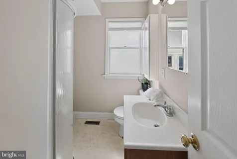 a bathroom with a sink and mirror