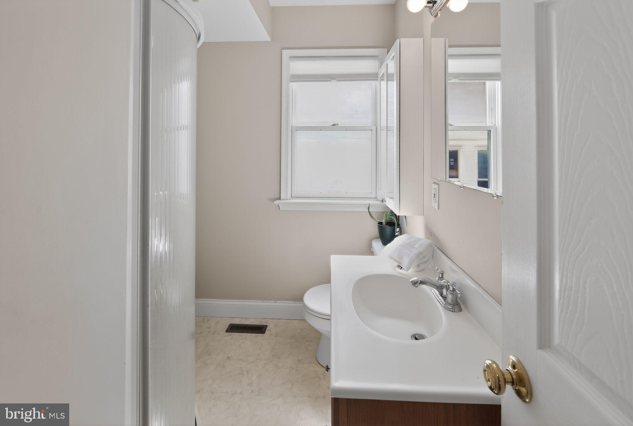 14 North Concord Road West Chester, PA 19380 - Photo 11 of 25 a bathroom with a sink and mirror
