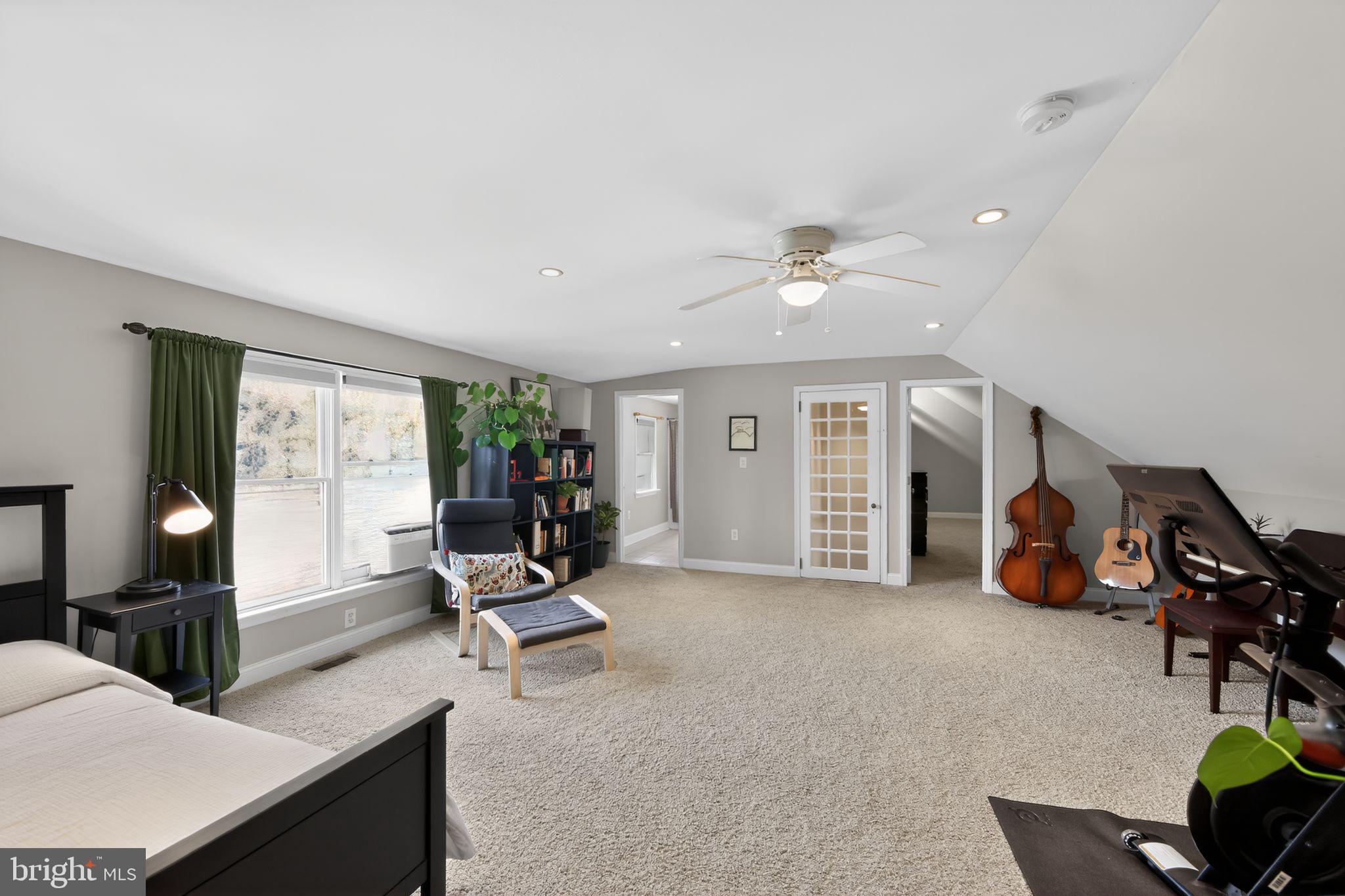 14 North Concord Road West Chester, PA 19380 - Photo 12 of 25 a living room with furniture gym equipment and large windows