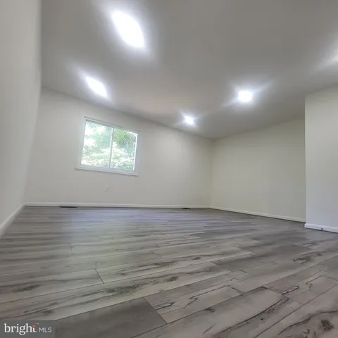 a white toilet sitting next to a sink