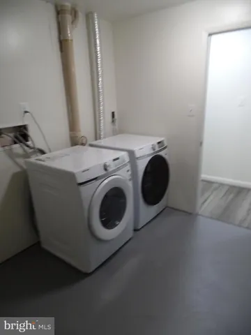 a view of a hallway view with wooden floor and staircase