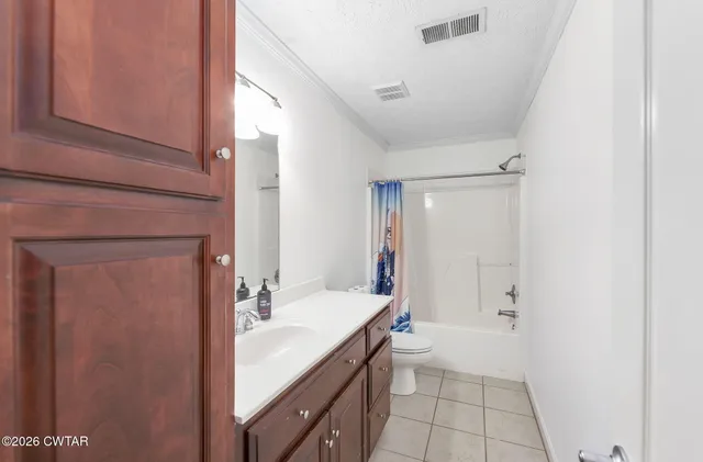 a bathroom with a sink a mirror and a shower