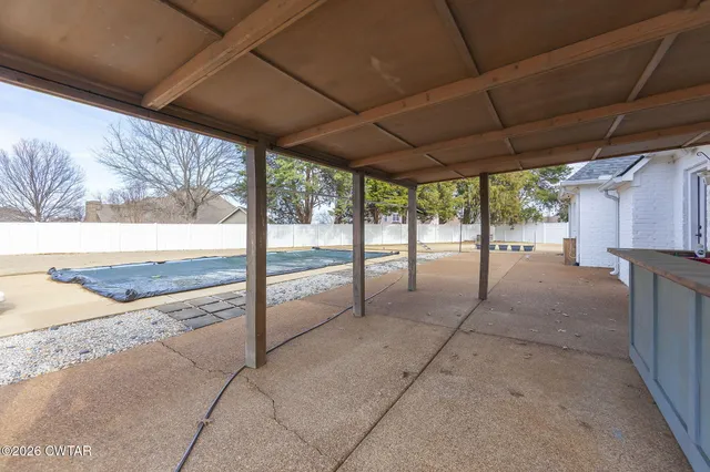 a view of a backyard of the house