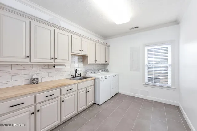 a kitchen with appliances cabinets and a sink