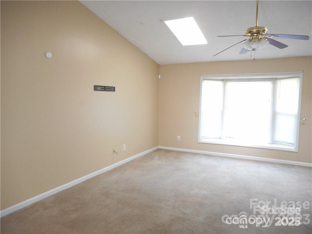 8319 Golf Ridge Drive Charlotte, NC 28277 - Photo 14 of 20 an empty room with a window