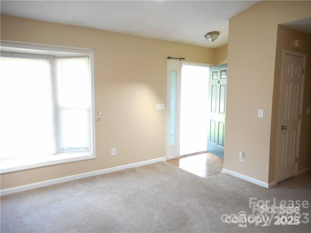 8319 Golf Ridge Drive Charlotte, NC 28277 - Photo 16 of 20 a view of an empty room with a window