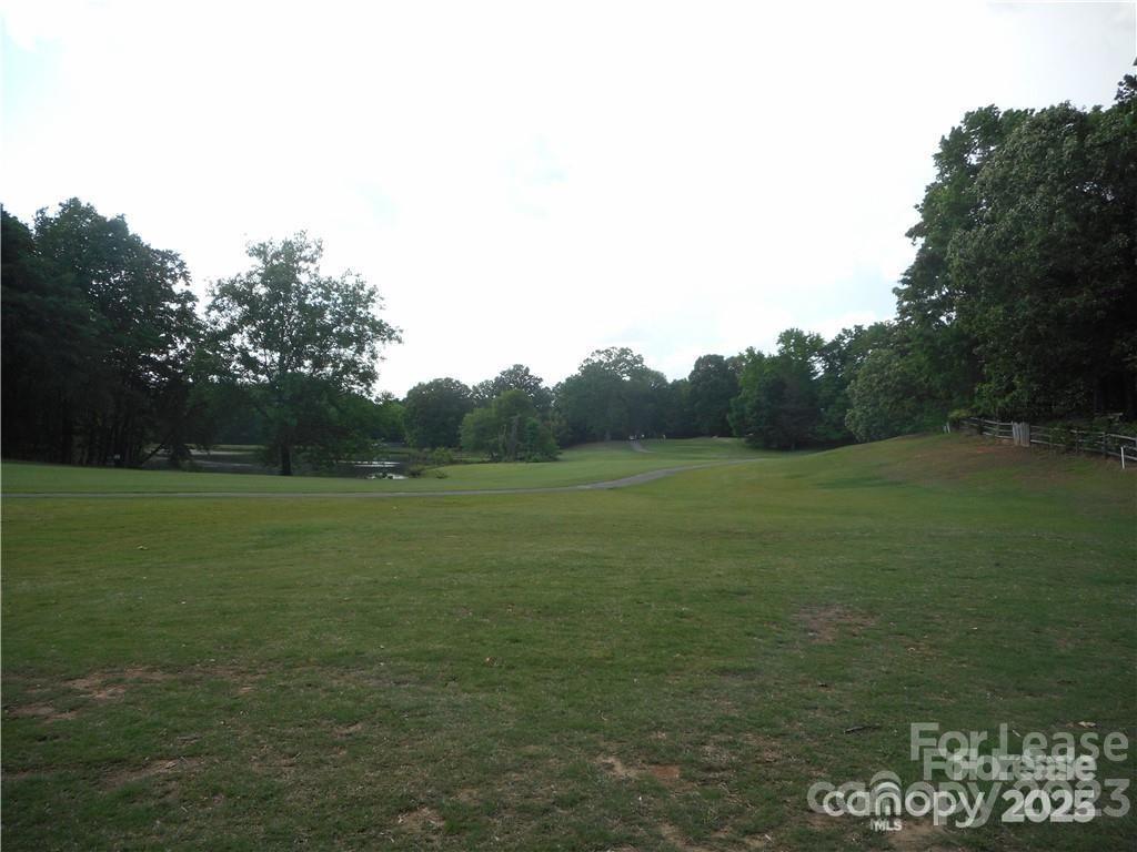 8319 Golf Ridge Drive Charlotte, NC 28277 - Photo 19 of 20 a view of a field with an trees