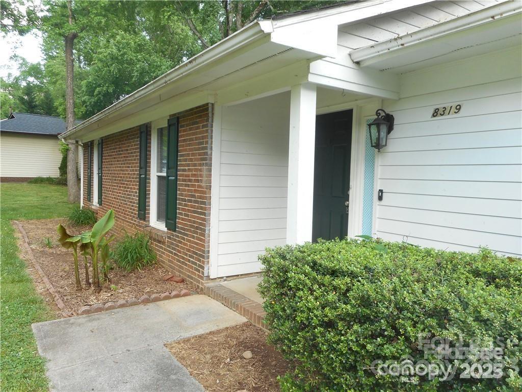 8319 Golf Ridge Drive Charlotte, NC 28277 - Photo 2 of 20 a view of a house with a yard