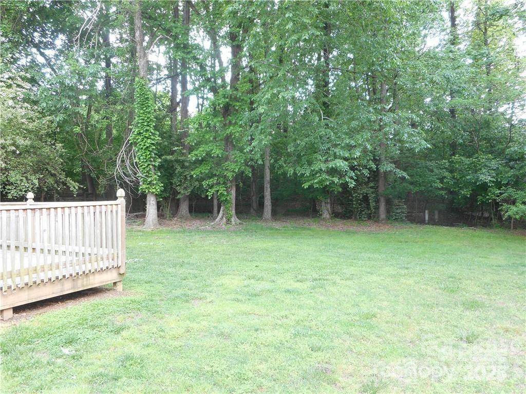 8319 Golf Ridge Drive Charlotte, NC 28277 - Photo 8 of 20 a view of a deck with a small yard